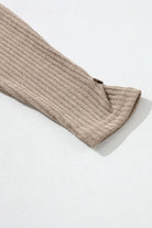 Close-up of the ribbed texture on the sleeve of the UNLIMITED POTENTIAL Top by Vivian-Lu in a beige hue.