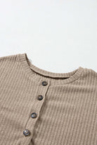 Close-up of UNLIMITED POTENTIAL knit top by Vivian-Lu featuring Henley design and ribbed texture in beige color.