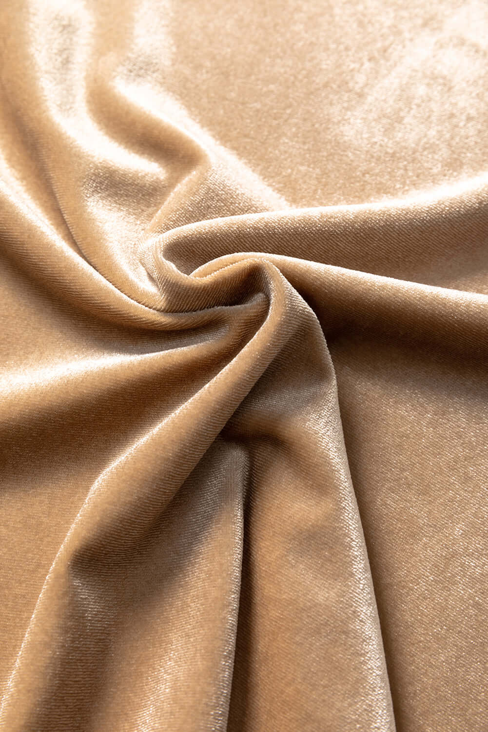 Champagne-hued velvet fabric showcasing soft texture and elegant drape.