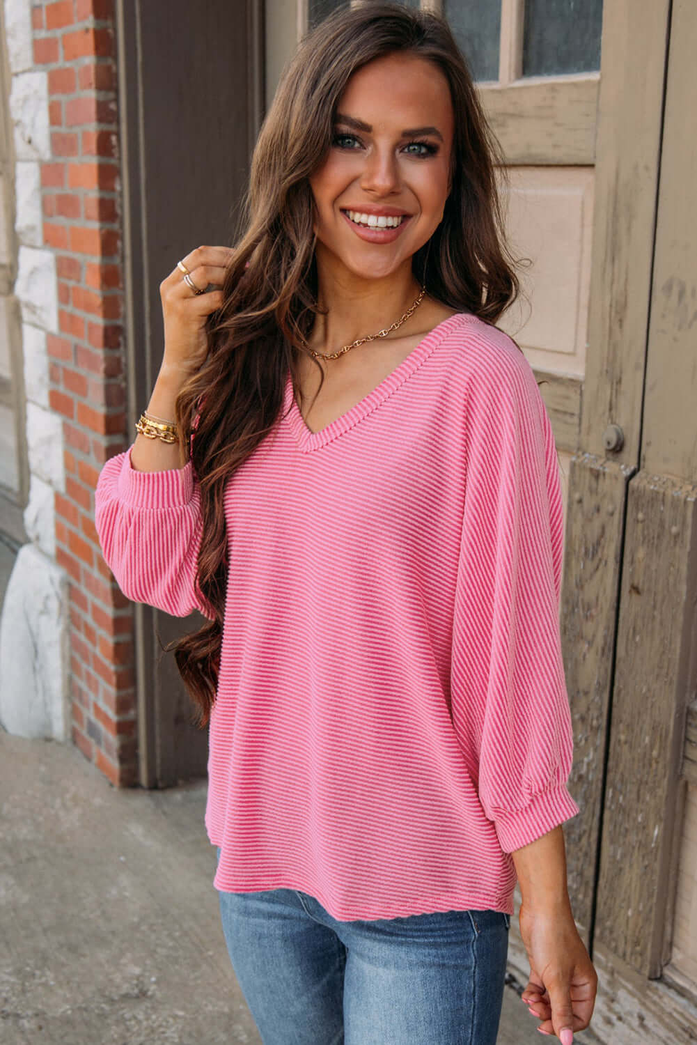 Happy Thoughts Top by Vivian-Lu in pink striped fabric, featuring a ribbed v-neck and bracelet sleeves, perfect for casual wear.