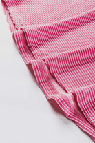 Close-up of the pink striped fabric of HAPPY THOUGHTS Top by Vivian-Lu, showcasing its ribbed texture and elegant design.