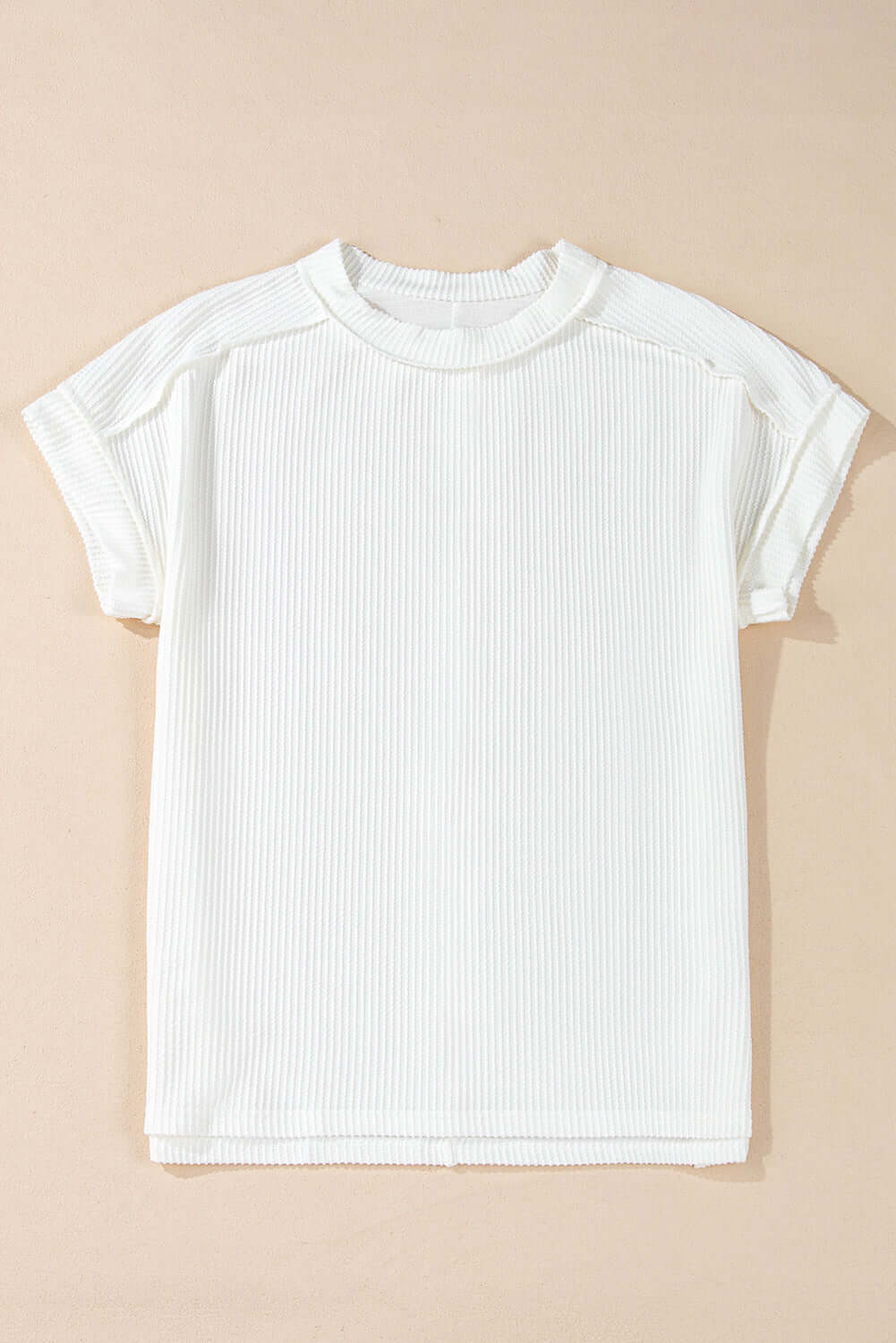 VANILLA VIBE Ribbed Top in warm ivory, showcasing lightweight ribbed knit and relaxed fit for everyday wear.