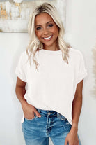 Model wearing VANILLA VIBE Ribbed Top in warm ivory, styled with casual jeans for a chic everyday look.