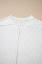 Back view of the VANILLA VIBE Ribbed Top showcasing its soft, ribbed texture and unique seam details.