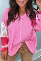 Radiant Lace Boho Top in pink with lace sleeves and V-neck, perfect for a chic, modern look.