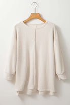 Cozy waffle knit top with batwing sleeves by Vivian-Lu, perfect for casual styling with skinny jeans or leggings.