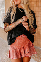 Model wearing Enchanted Moonlight Tee with floral mesh sleeves and a pink ruffled skirt.