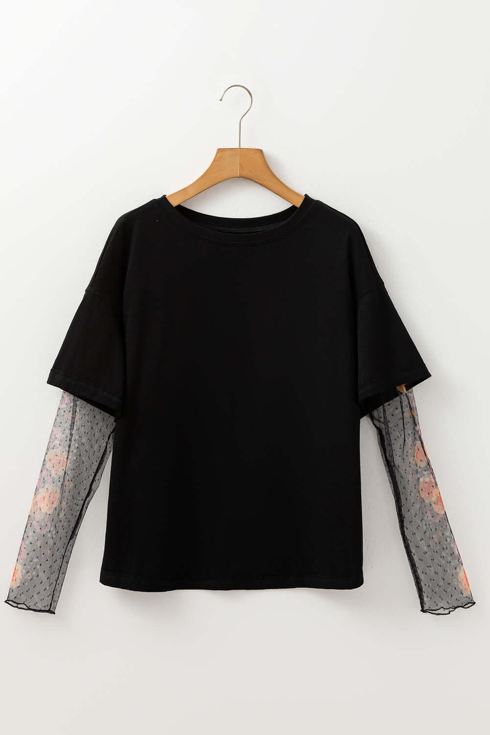 Black Enchanted Moonlight Tee with floral mesh long sleeves for a stylish layered look.