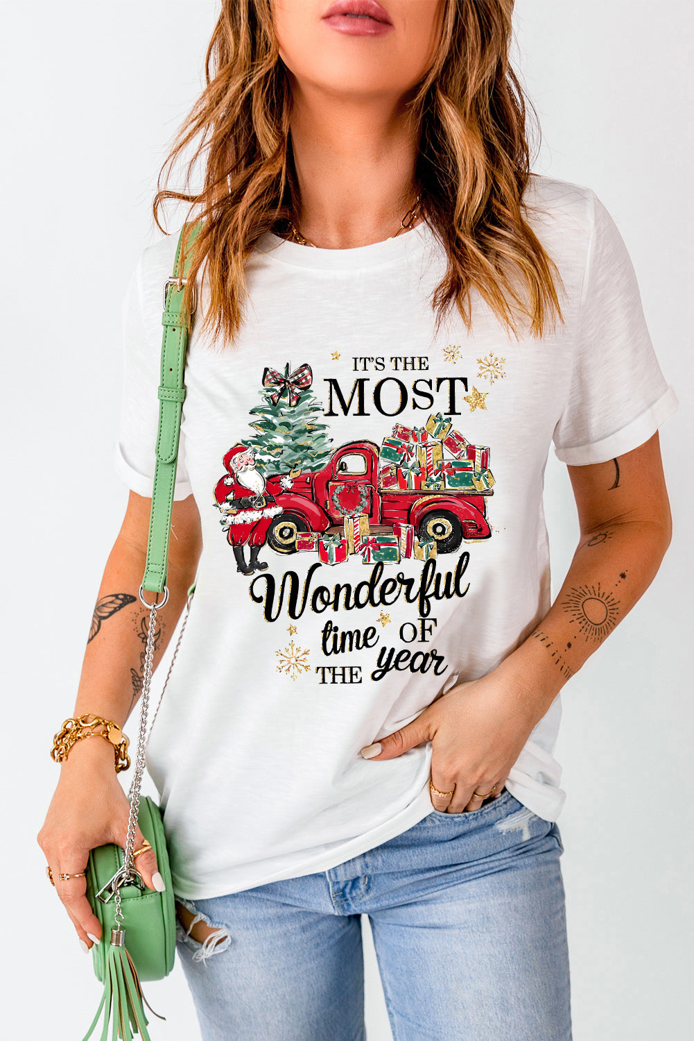Woman wearing 'Most Wonderful Time' holiday t-shirt with a red truck and gifts design, perfect for festive layering.