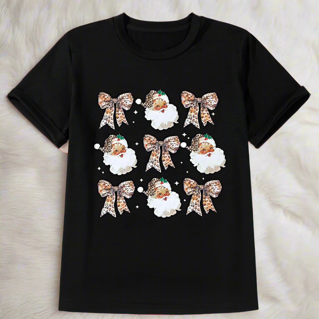 Festive T-shirt with leopard print bows and Santa Claus graphics on a black background, perfect for holiday celebrations.