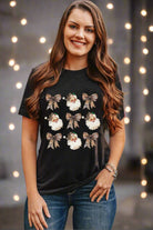 Woman wearing a festive T-shirt with Santa Claus and leopard print bows, ideal for holiday celebrations and casual outings.