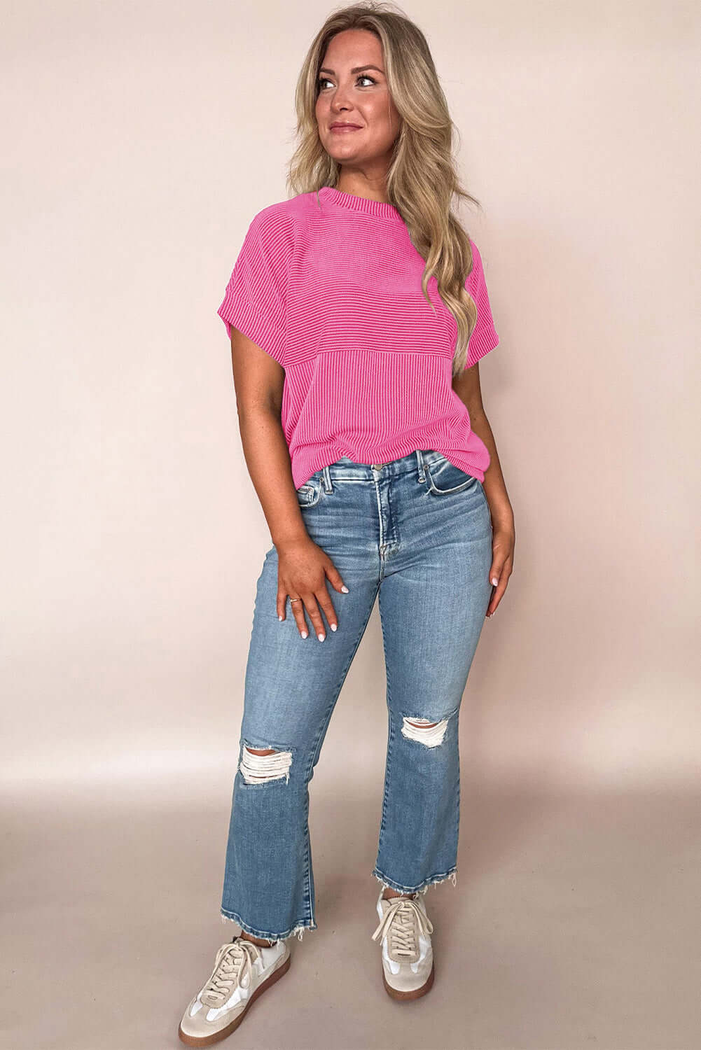 Hot pink Color Code top styled with ripped jeans for a trendy, relaxed look. Perfect for all-day comfort!