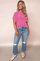 Hot pink Color Code top styled with ripped jeans for a trendy, relaxed look. Perfect for all-day comfort!