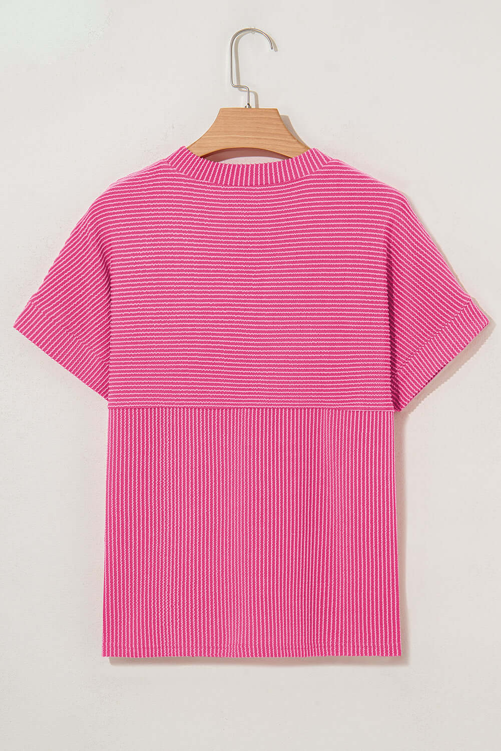 Back view of a mock neck hot pink striped knit top with relaxed fit for all-day comfort.