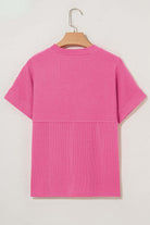 Back view of a mock neck hot pink striped knit top with relaxed fit for all-day comfort.