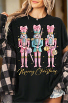 Festive T-shirt with colorful nutcracker design and "Merry Christmas" text, perfect for holiday celebrations and casual wear.