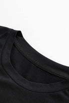 Close-up of a black T-shirt collar highlighting the soft, breathable fabric ideal for comfortable all-day wear.