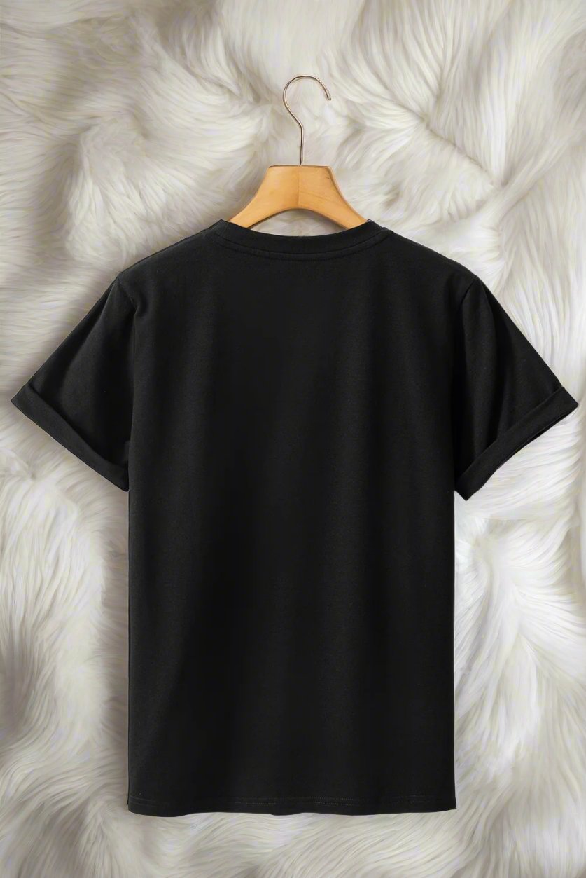 Black DANCE OF THE NUTCRACKER T-shirt on hanger with soft fur backdrop