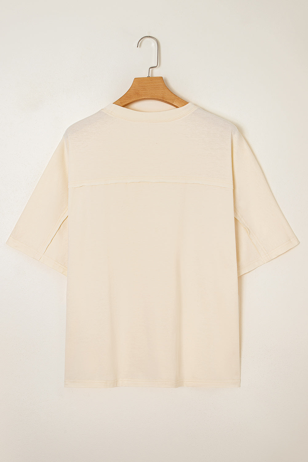 Back view of Happiness Blooms Top in vanilla, showcasing relaxed fit and soft fabric, perfect for casual wear.