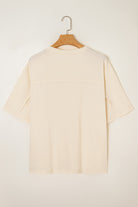 Back view of Happiness Blooms Top in vanilla, showcasing relaxed fit and soft fabric, perfect for casual wear.