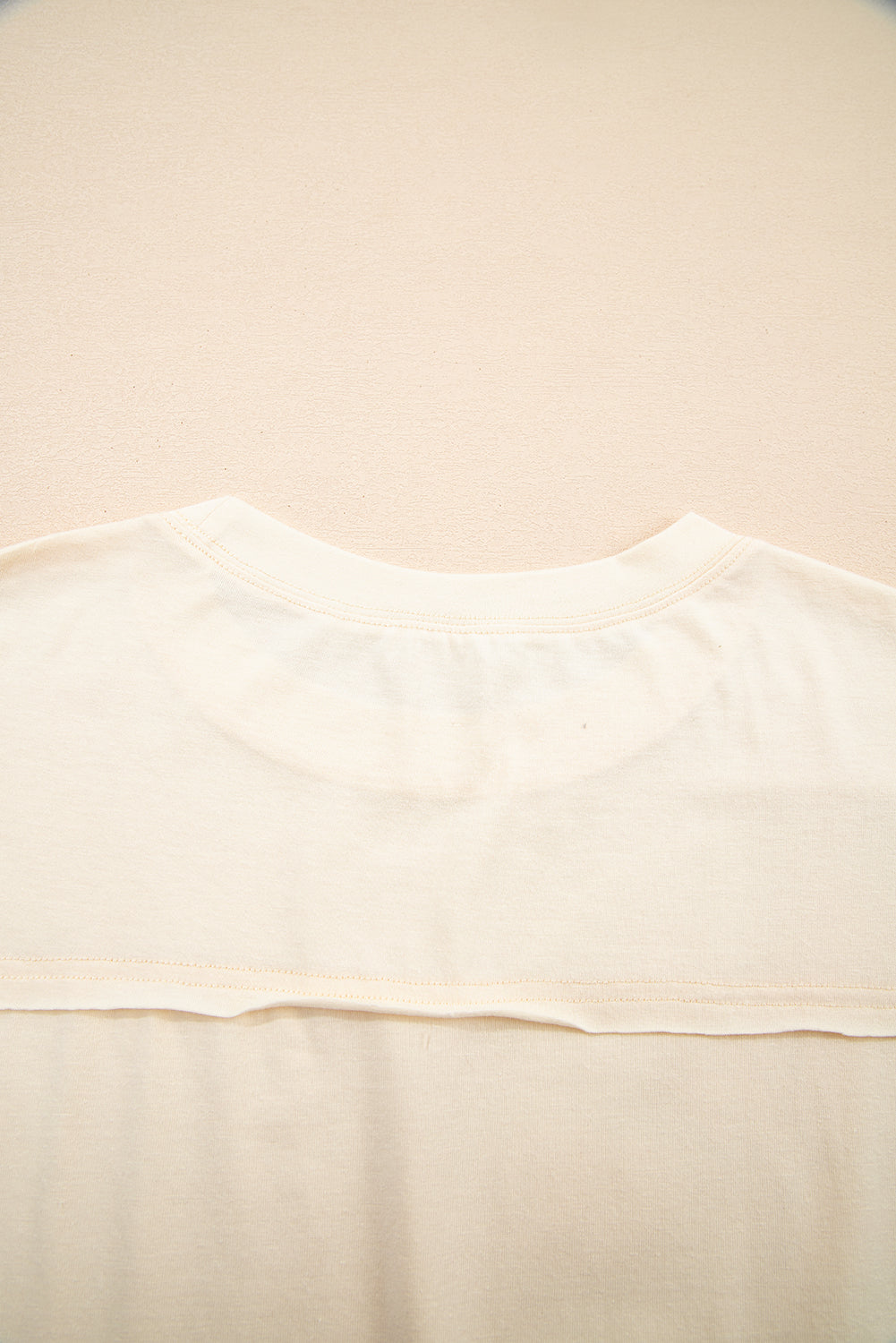 Happiness Blooms Top in vanilla cream showcasing relaxed fit and soft fabric from the back view.