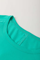 Teal lace top collar detail showcasing raw edge trim of the Ribbon Theory Top.