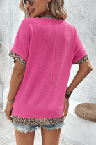 Bright pink leopard patchwork V-neck top, casual-chic style with comfy fit and trendy design.
