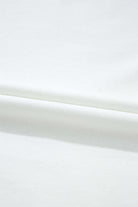 Close-up of soft white fabric, showcasing the smooth texture ideal for Laced Logic Top.