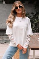 Model wearing Laced Logic Top with white lace long sleeves and casual style in outdoor setting.