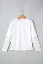 Laced Logic Top featuring white lace long sleeves and drop shoulder design, perfect for a chic layered look.