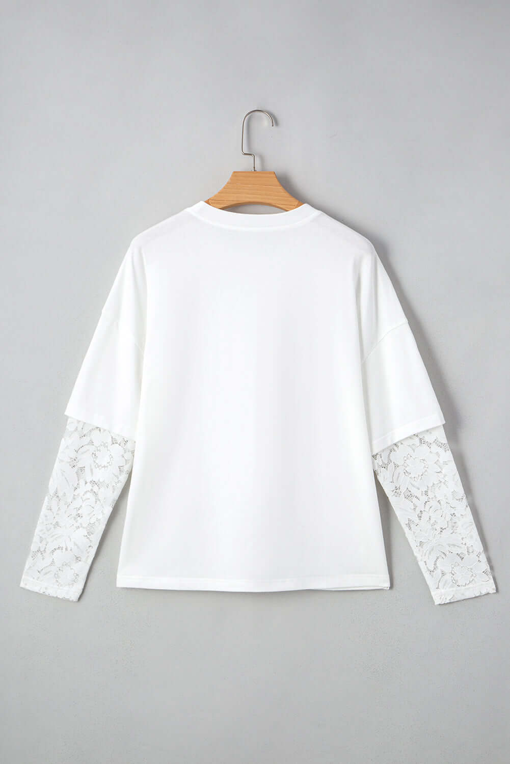 Back view of Laced Logic Top featuring white lace long sleeves on a minimalist tee.