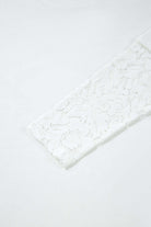 Close-up of Laced Logic Top featuring white lace long sleeve insert on a minimalist tee.