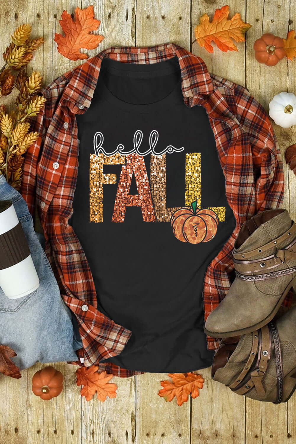 HELLO FALL TEE featuring colorful lettering and pumpkin graphic, styled with a plaid shirt and autumn decor.
