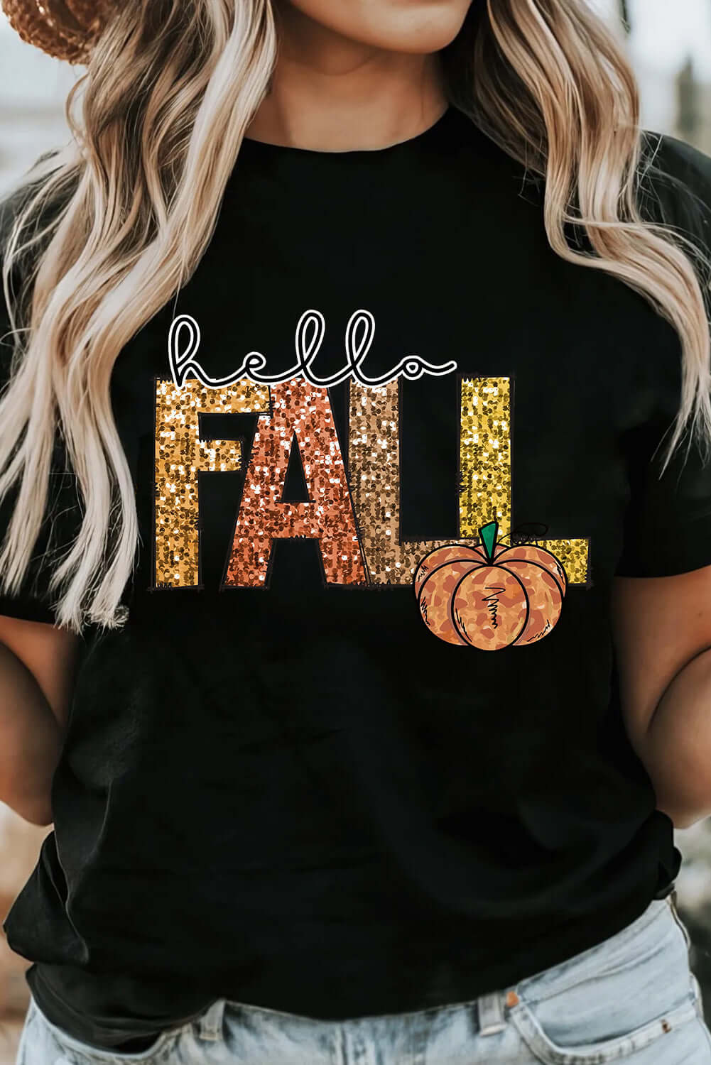 HELLO FALL TEE featuring glittery lettering and a pumpkin graphic on a black t-shirt, perfect for autumn style.