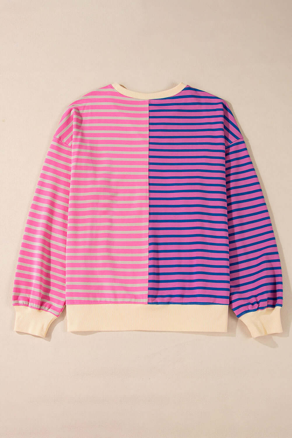 Oversized color block sweatshirt in pink and blue stripes, featuring a relaxed fit and drop shoulder design.