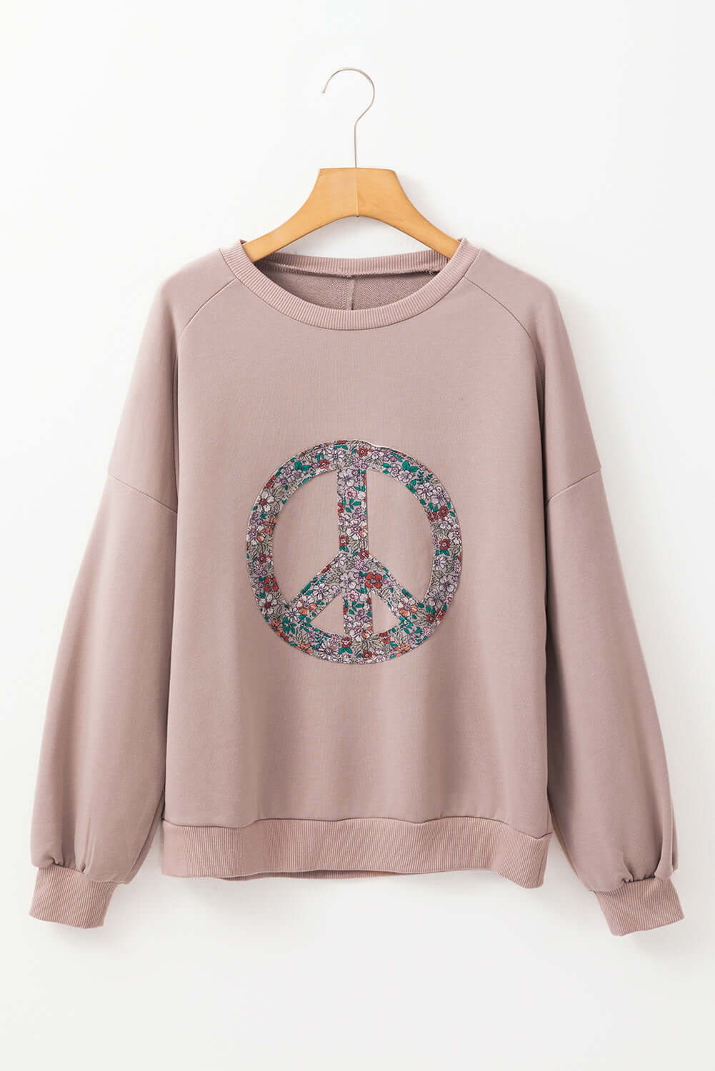 Cozy INNER PEACE sweatshirt with peace symbol, featuring drop shoulders and long sleeves. Ideal for stylish, relaxed looks.