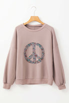 Cozy INNER PEACE sweatshirt with peace symbol, featuring drop shoulders and long sleeves. Ideal for stylish, relaxed looks.