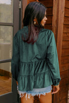 Woman wearing forest green ruffle tiered State of Grace top by Vivian-Lu, showing back view, paired with denim shorts.