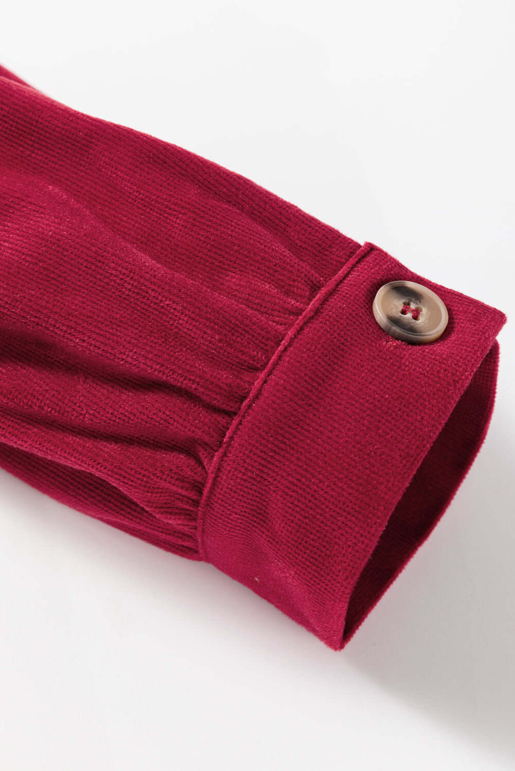 Burgundy ruffle sleeve detail with button on State of Grace top by Vivian-Lu.