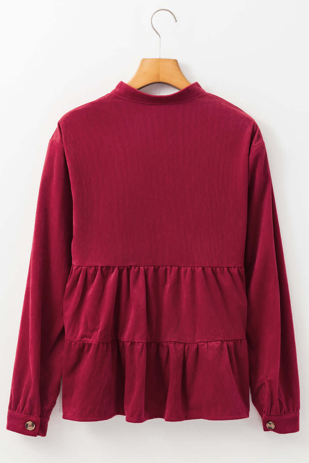 Burgundy Vivian-Lu State of Grace top with ruffle tiers and button-up design, back view on hanger.