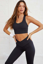 Model wearing WALK AWAY leggings by Vivian-Lu, showcasing seamless design and arched-waist for a flattering workout look.