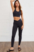 Model showcasing WALK AWAY leggings by Vivian-Lu, featuring a seamless design and arched waist for tummy control.