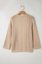 Back view of Café Date Cardigan in apricot beige, featuring solid cable knit and hollow-out details.