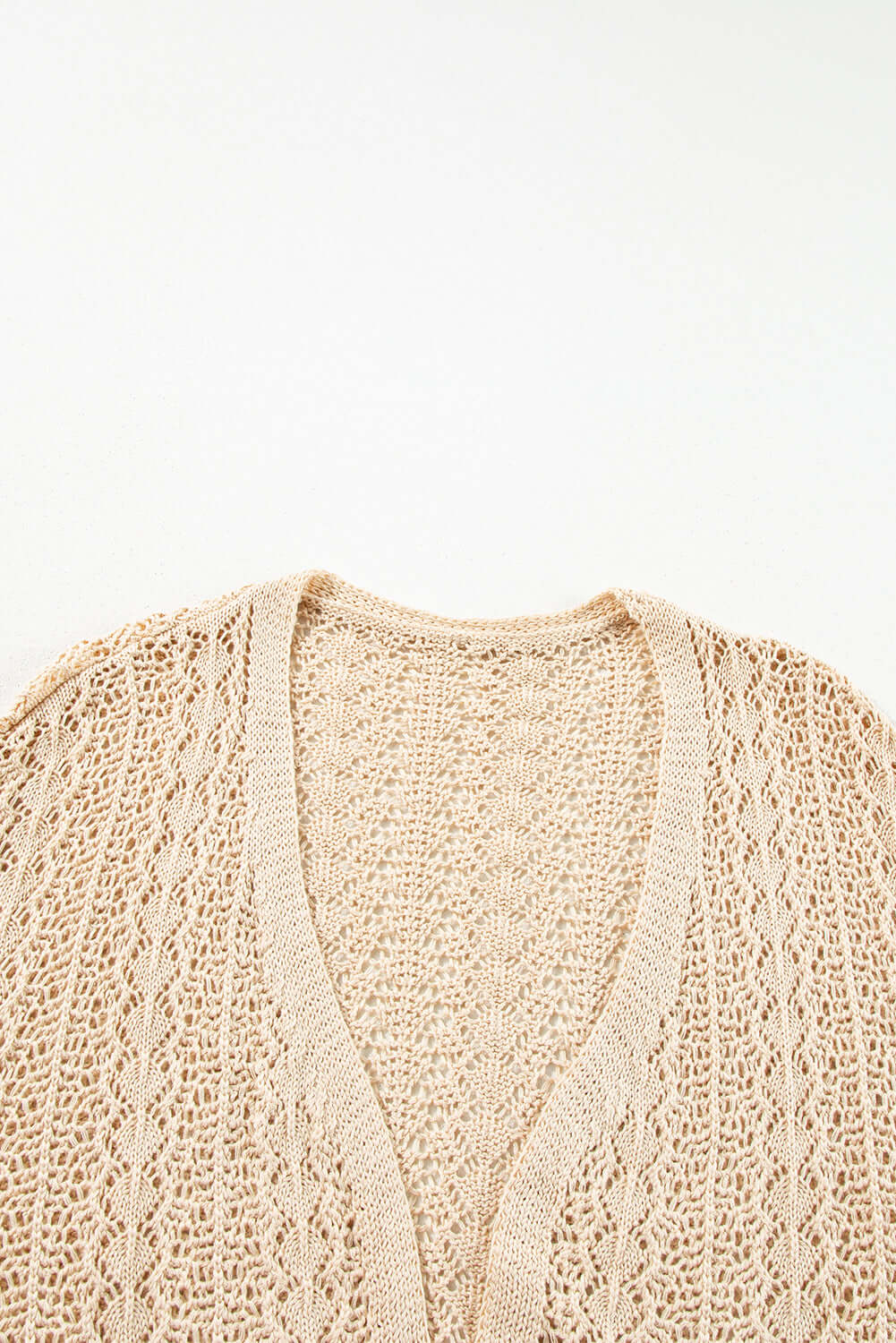 Café date cardigan in apricot beige with solid cable knit and hollow-out details.