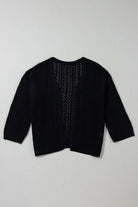 Café Date Cardigan in jet black, featuring cable knit and hollow-out details for a chic, cozy layering piece.