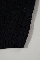 Close-up of black Café Date Cardigan showcasing solid cable knit and hollow-out details.