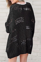 Back view of the Blackout Bliss Cardigan showcasing its open cable-knit design and relaxed fit.