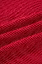 Textured close-up of the cozy Fiery Red fabric used in the MERRY MOMENTS SWEATER.