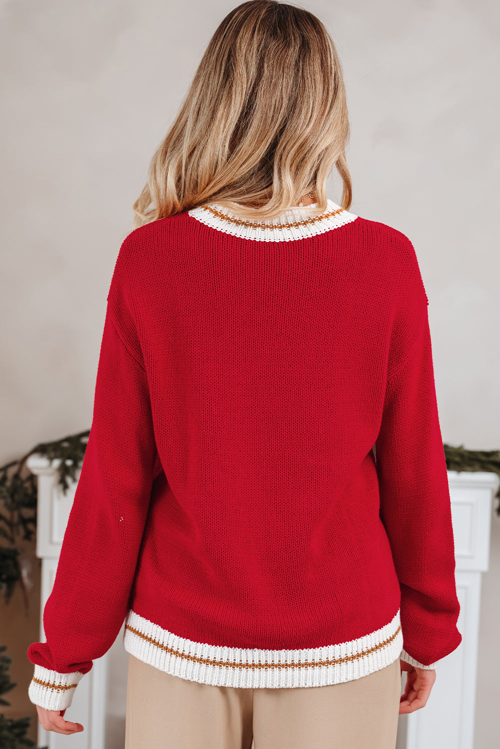 Back view of the MERRY MOMENTS SWEATER showcasing its cozy design and festive red color.