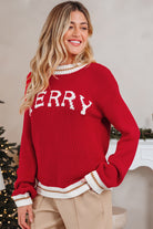 MERRY MOMENTS SWEATER featuring bold MERRY graphic, cozy red color, and relaxed fit perfect for holiday celebrations.